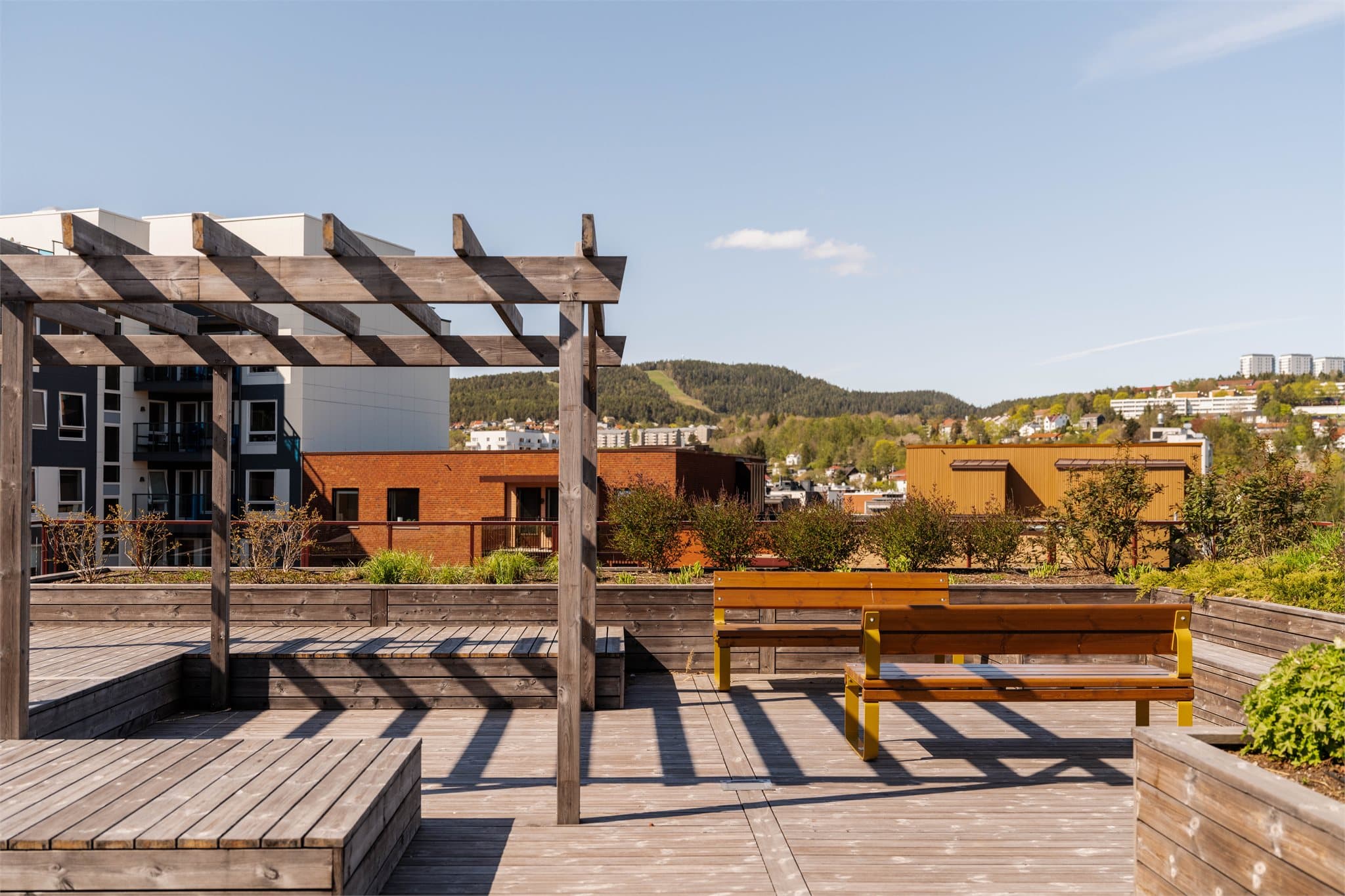 På taket kan beboerne nyte en flott, felles takterrasse med utsikt mot Grefsenkleiva.